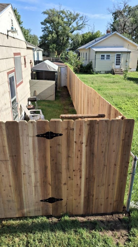 Wood privacy fence with a gate